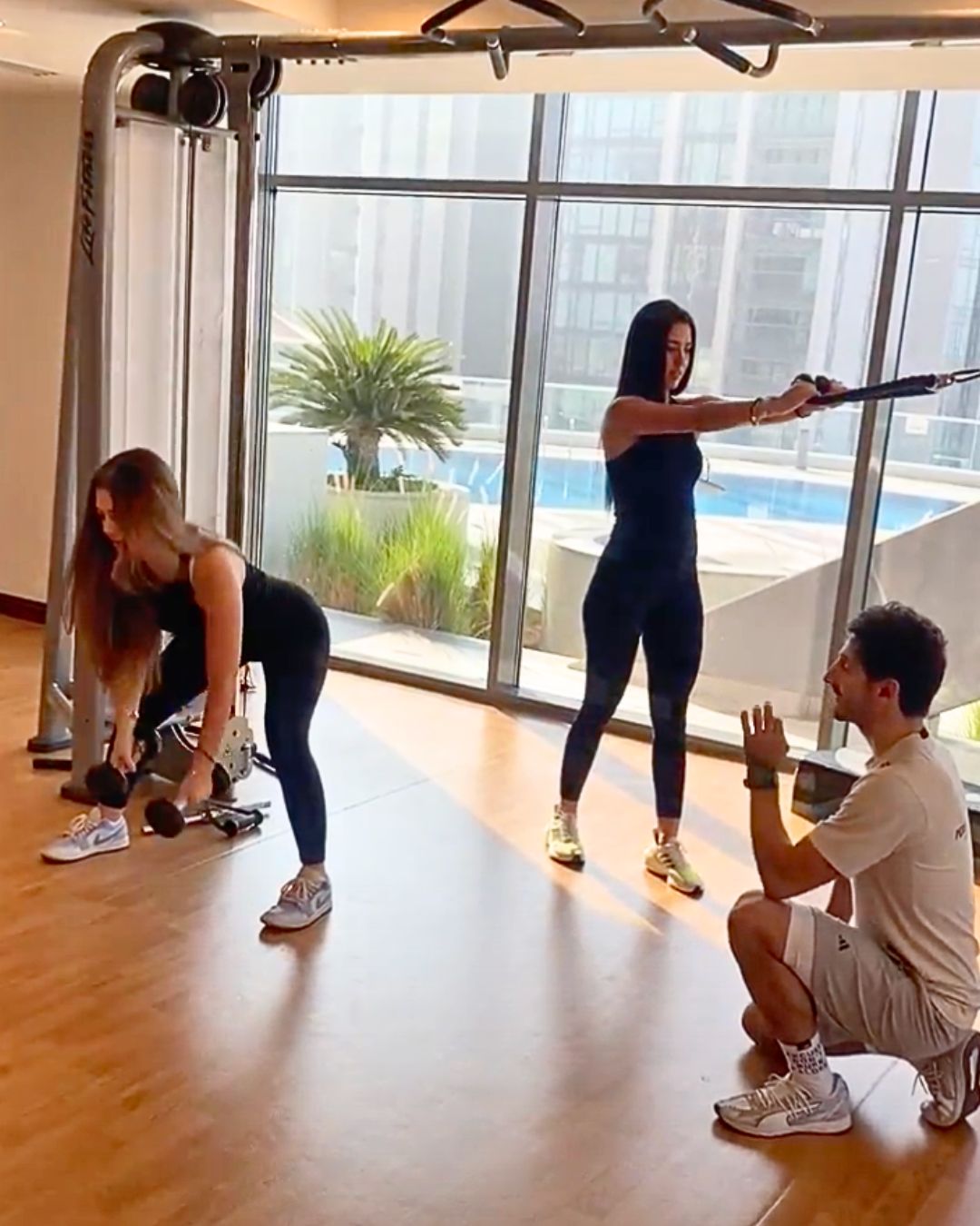 ETAD personal coach guiding women in a residential gym